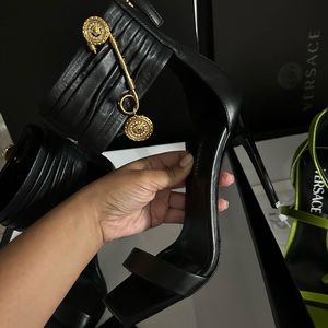 VERSACE
Safety Pin Lambskin Leather Stiletto Sandals